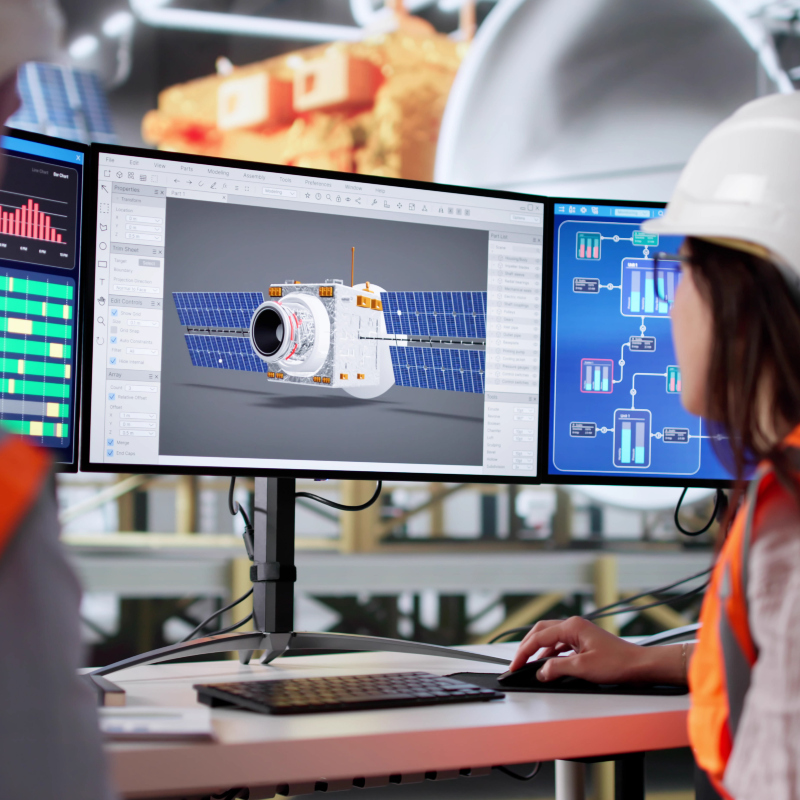 engineer reviewing a multideminsional image on a computer screen for the production of an advanced satellite
