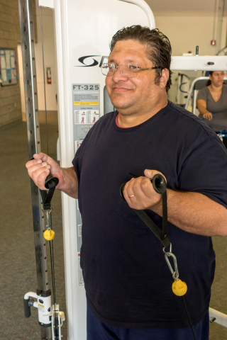 gentleman using equipment for upper body strength