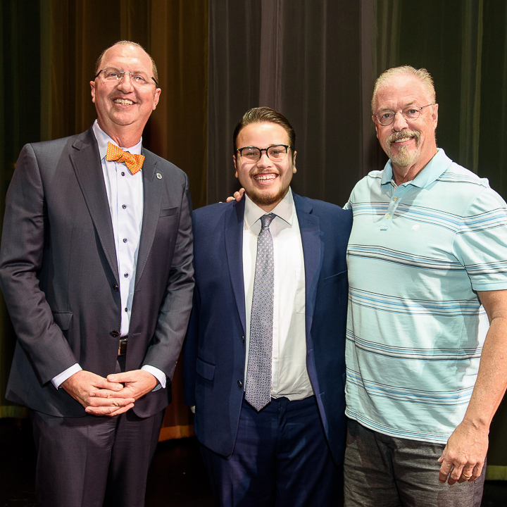 Dr. Greg Schulz, superintendent/president (left); Doug Austin, director of the Citrus Singers (right); Emilio Pichardo (center)